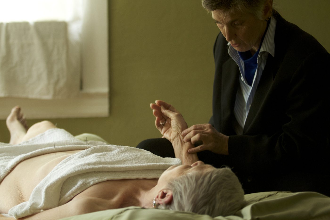 Dr. M. Cissy Majebe treating a patient